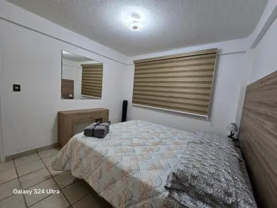 Cama o camas de una habitación en Amplio apartamento sobre Avenida Viaducto