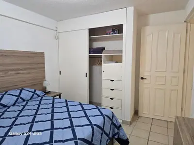 Cama o camas de una habitación en Amplio apartamento sobre Avenida Viaducto