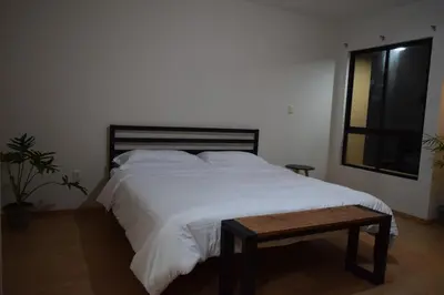 Cama o camas de una habitación en Octava de Orquídeas - Casa completa con estacionamiento y terraza