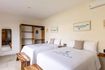 Cama o camas de una habitación en Isla Neptuno