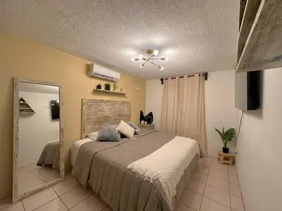 Cama o camas de una habitación en Departamento Céntrico en Huatulco climatizado