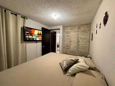 Cama o camas de una habitación en Departamento Céntrico en Huatulco climatizado