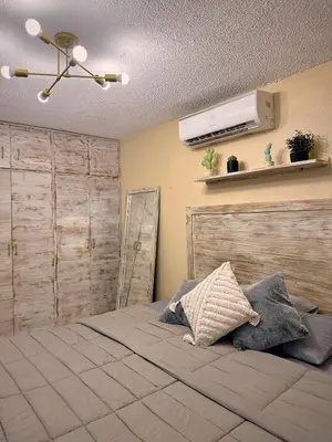Cama o camas de una habitación en Departamento Céntrico en Huatulco climatizado