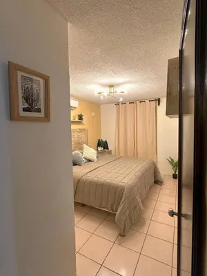 Cama o camas de una habitación en Departamento Céntrico en Huatulco climatizado