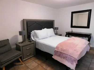 Cama o camas de una habitación en Hospedaje GNP & Autódromo