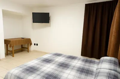 Cama o camas de una habitación en Nova Stay Puebla
