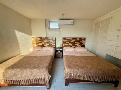 Cama o camas de una habitación en Hermoso departamento en condominio de Costa Azul