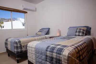 Cama o camas de una habitación en Padrísimo depto frente al mar