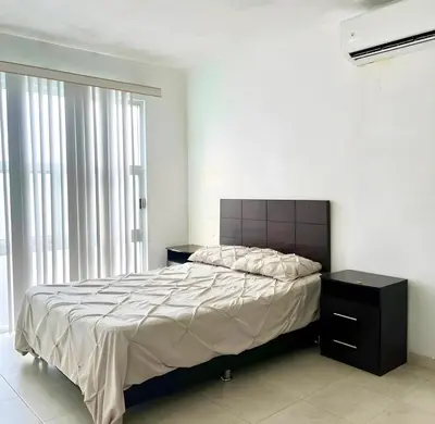 Cama o camas de una habitación en Casa MODERNA MALECON PLAYA