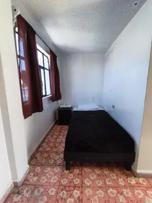 Cama o camas de una habitación en Alas Host