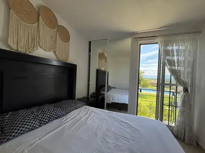 Cama o camas de una habitación en CASALUNA frente alberca AirAc
