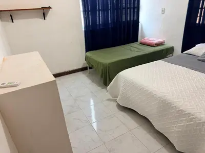 Cama o camas de una habitación en Departamento completo bien ubicado