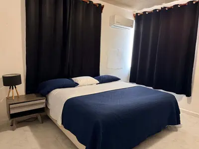 Cama o camas de una habitación en Departamento completo bien ubicado