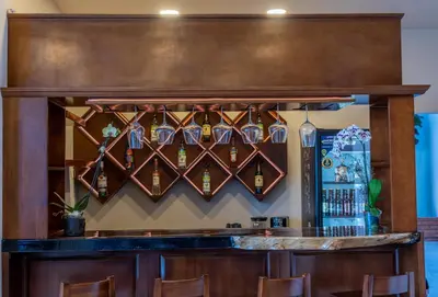 El salón o zona de bar de Galerias Oaxaca Suites