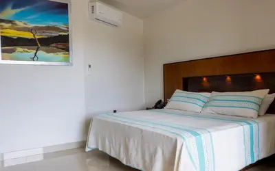 Cama o camas de una habitación en Galerias Oaxaca Suites