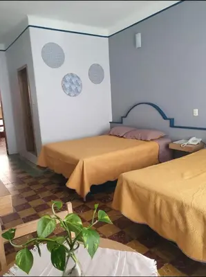 Cama o camas de una habitación en Hotel Rivera