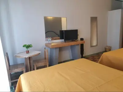 Cama o camas de una habitación en Hotel Rivera