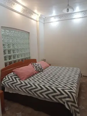 Cama o camas de una habitación en La casa del Jardín