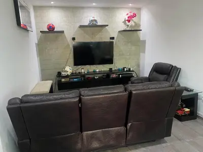 Una televisión o centro de entretenimiento en La PRIMAVERA APARTMENT IN CUERNAVACA