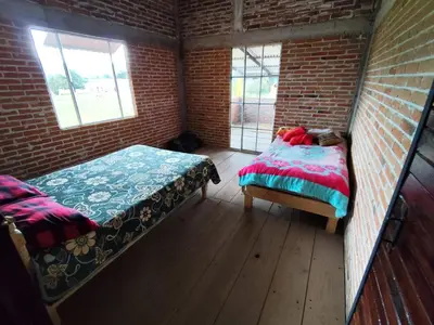 Cama o camas de una habitación en Cabañas Rancho Guadalupe