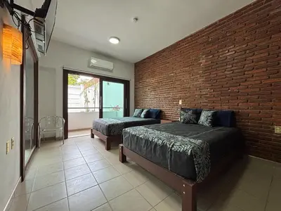 Cama o camas de una habitación en Hotel Monkey House Tuxtla Gutiérrez
