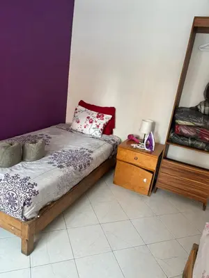 Cama o camas de una habitación en minidpto accesible para moverte a toda la ciudad