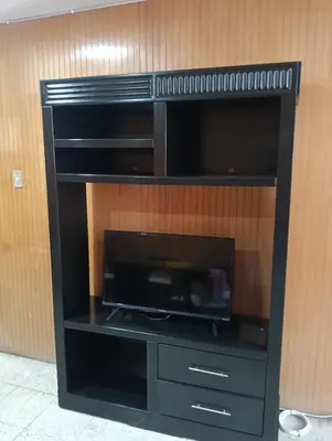 Una televisión o centro de entretenimiento en Departamento 4 Ote