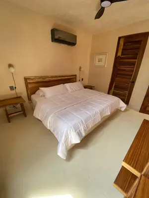 Cama o camas de una habitación en Condominios Punta Morelos