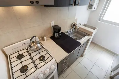 Una cocina o zona de cocina en Depto moderno cerca Estadio GNP y Aeropuerto