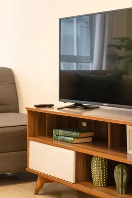 Una televisión o centro de entretenimiento en Depto moderno cerca Estadio GNP y Aeropuerto