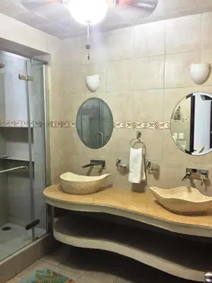 Un baño de Villa Costa Chica Comodisimo piscina gigante jardines