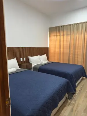Cama o camas de una habitación en Hotel Mochomos Huajuapan