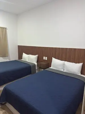 Cama o camas de una habitación en Hotel Mochomos Huajuapan