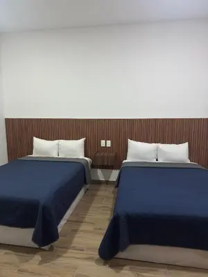 Cama o camas de una habitación en Hotel Mochomos Huajuapan