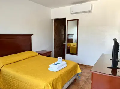 Cama o camas de una habitación en Resort Misión del Mar