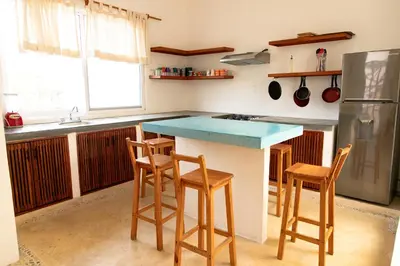 Una cocina o zona de cocina en CASA GUAJE 5min to Beach Bacocho and Coral 3Floor House 6 Bedrooms all with AC 8 beds up to 16 Guests Wifi starlink