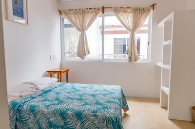 Cama o camas de una habitación en CASA GUAJE 5min to Beach Bacocho and Coral 3Floor House 6 Bedrooms all with AC 8 beds up to 16 Guests Wifi starlink