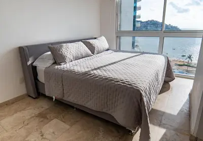 Cama o camas de una habitación en Departamento para 12 personas con vista al mar
