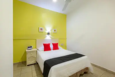 Cama o camas de una habitación en Oaxaca Guest Hotel