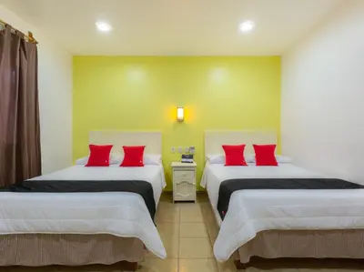 Cama o camas de una habitación en Oaxaca Guest Hotel