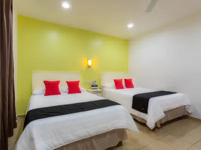 Cama o camas de una habitación en Oaxaca Guest Hotel