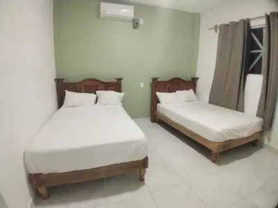 Cama o camas de una habitación en Casa Blanca Puerto Marqués 10