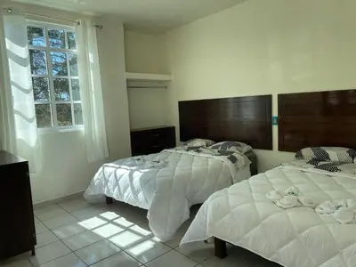 Cama o camas de una habitación en Hotel Leilani