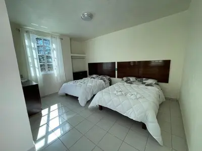 Cama o camas de una habitación en Hotel Leilani