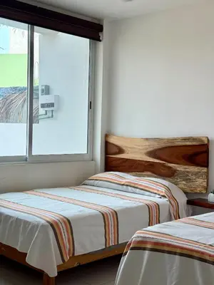 Cama o camas de una habitación en Comfortable Apt near the Beach
