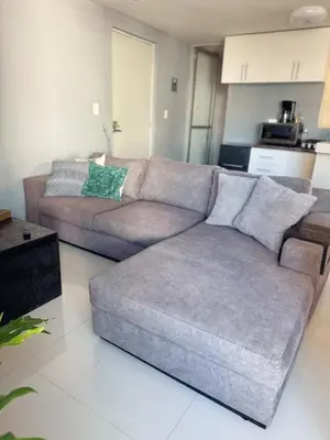 Zona de estar de Cómodo departamento