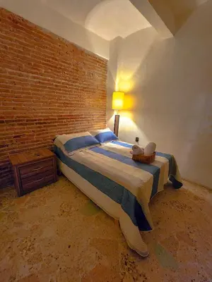 Cama o camas de una habitación en Habitaciones CASA BULE