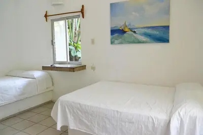 Cama o camas de una habitación en Hotel Cocoloco