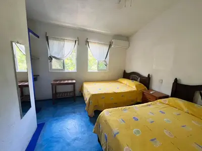 Cama o camas de una habitación en Hotel Cocoloco