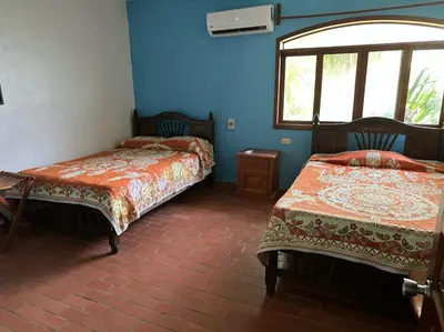 Cama o camas de una habitación en Hotel Cocoloco